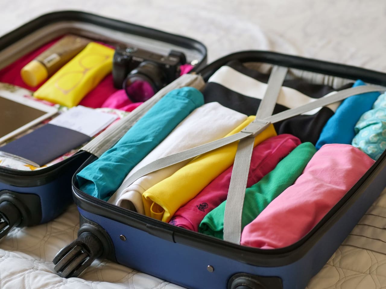 An open suitcase neatly packed for a holiday